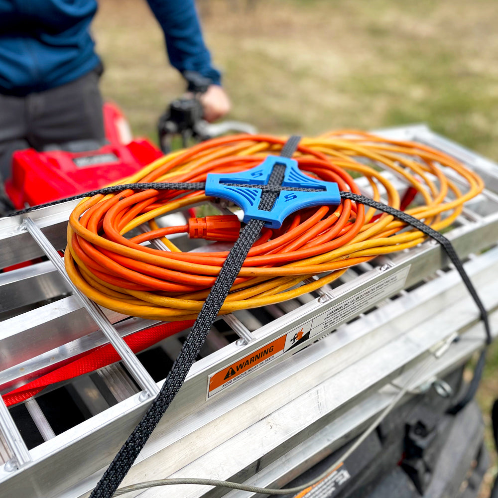 The Tack Strap securing cords and ladder on Quad Bike
