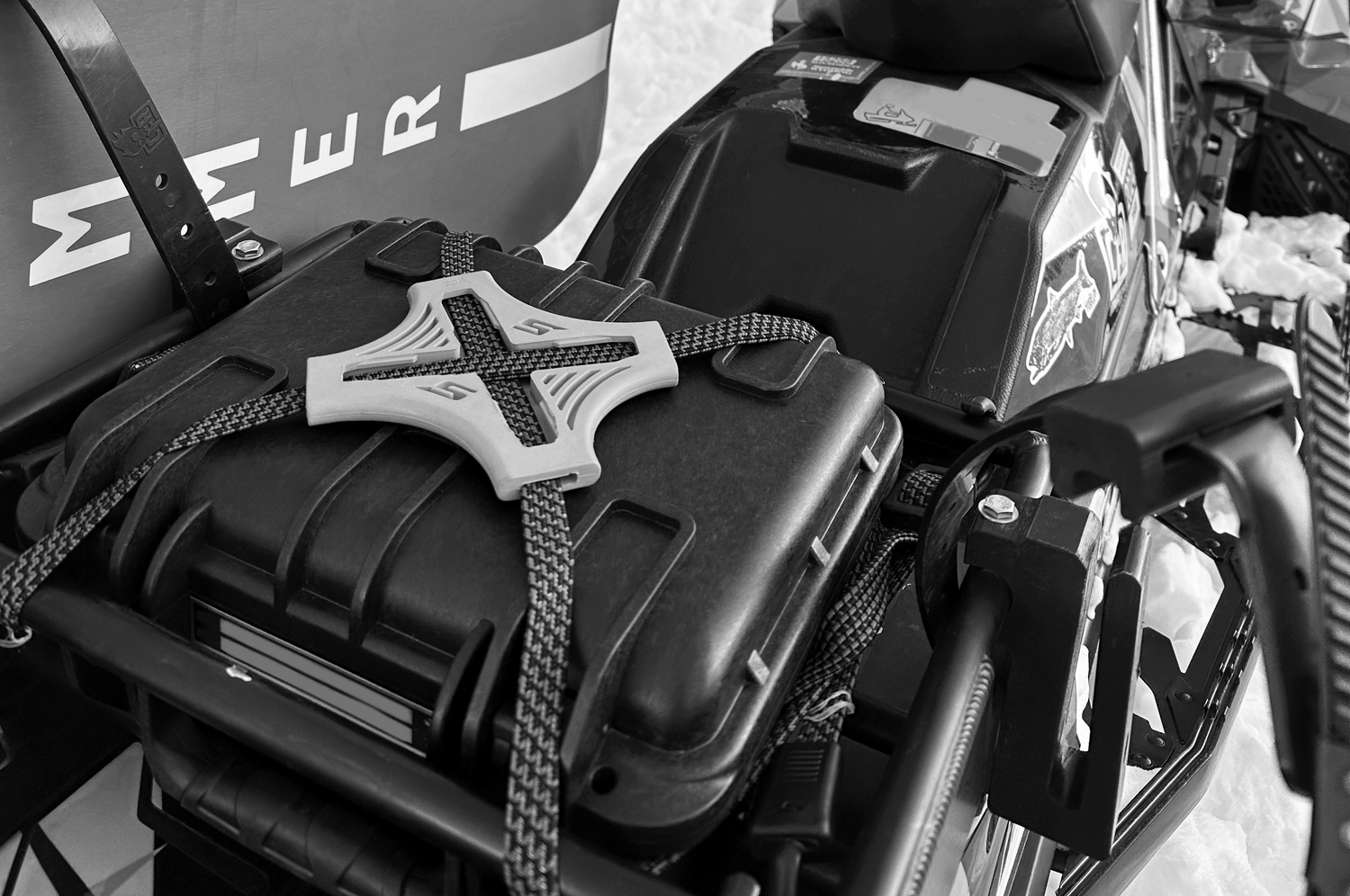 The Tack Strap securing a load on the back of a snow mobile